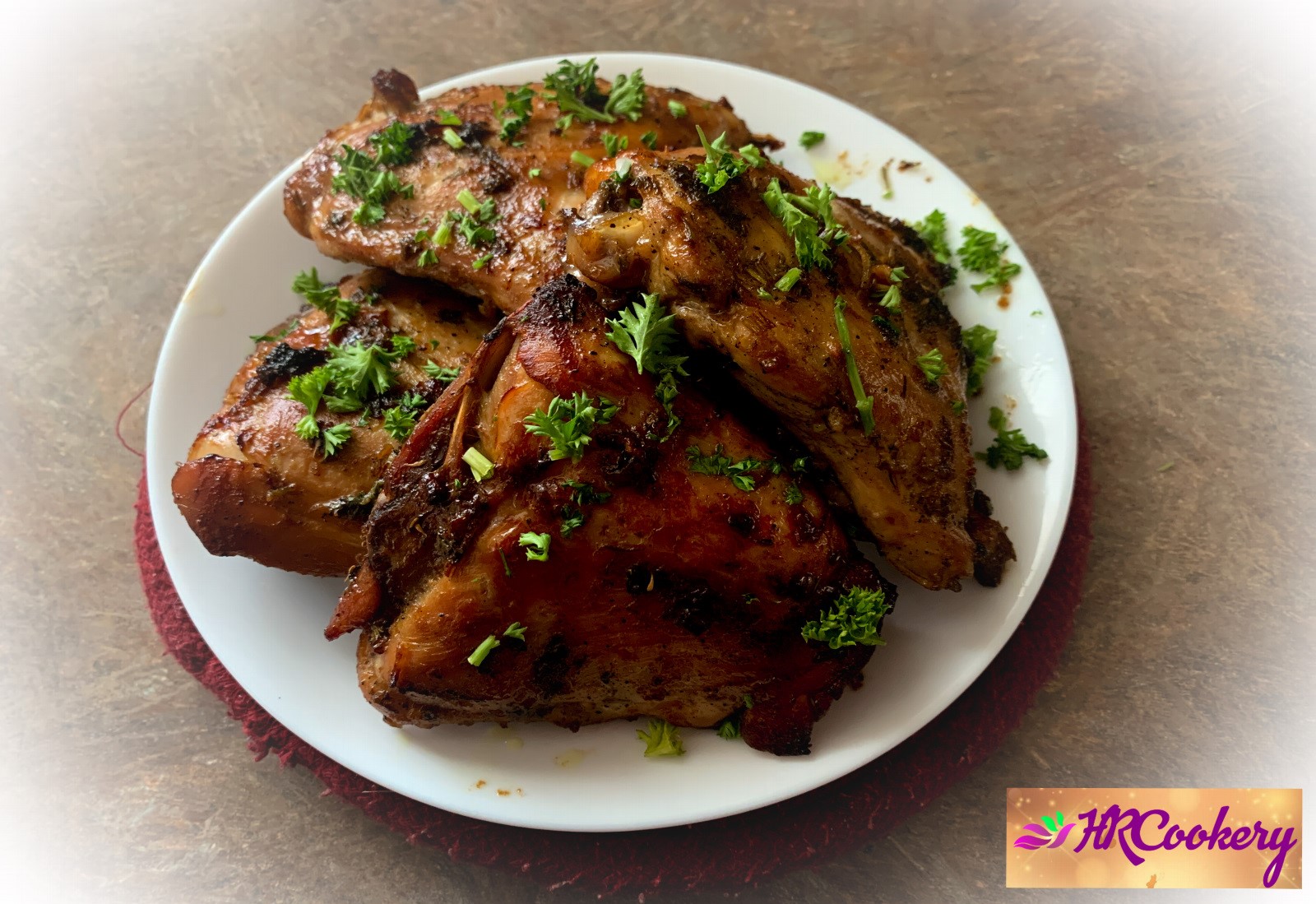 Herb-marinated chicken thighs with parsley, thyme, garlic, and lemon, ready to grill or bake