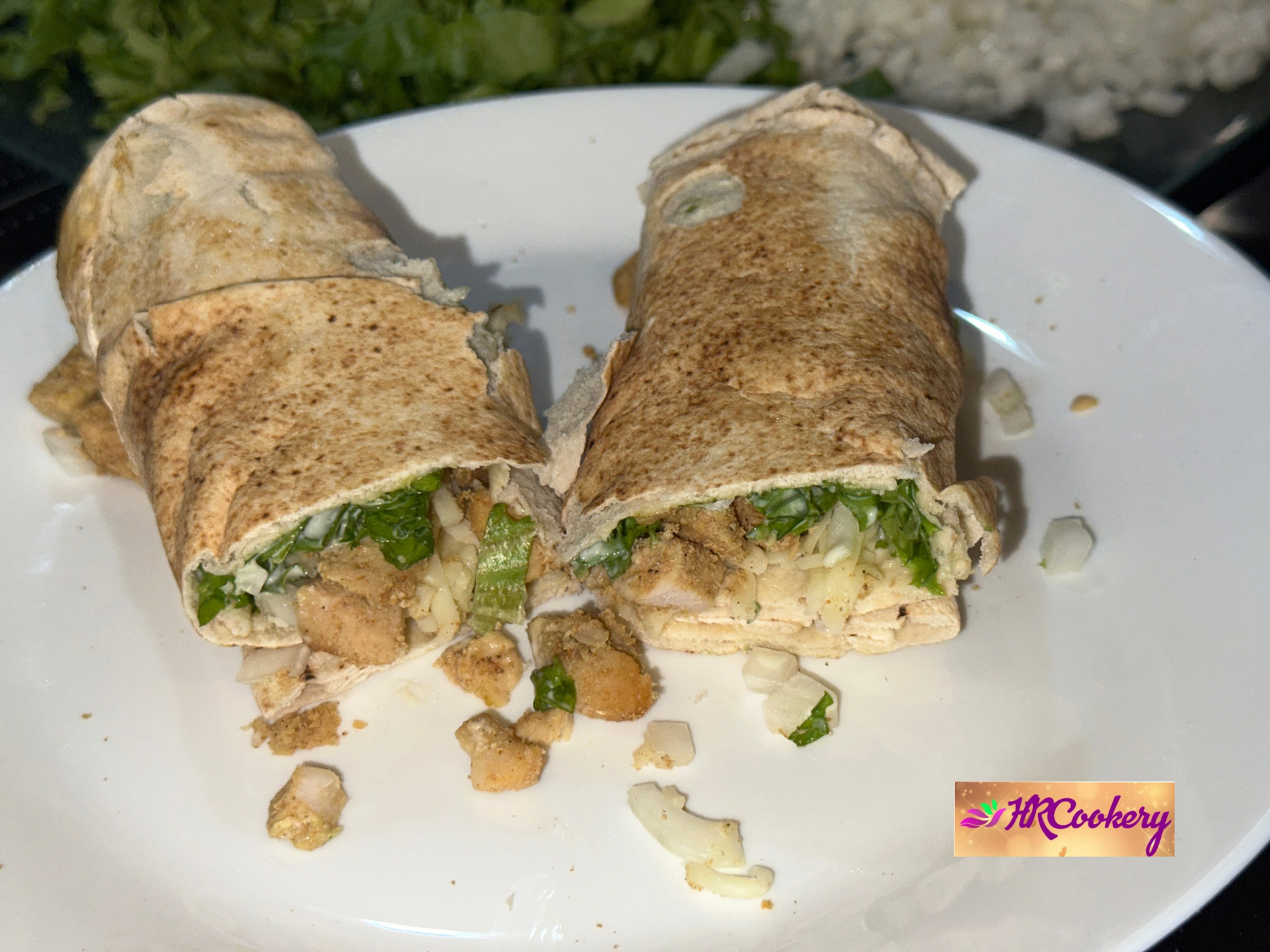 Skillet chicken seasoned with chili powder and spices next to tortillas