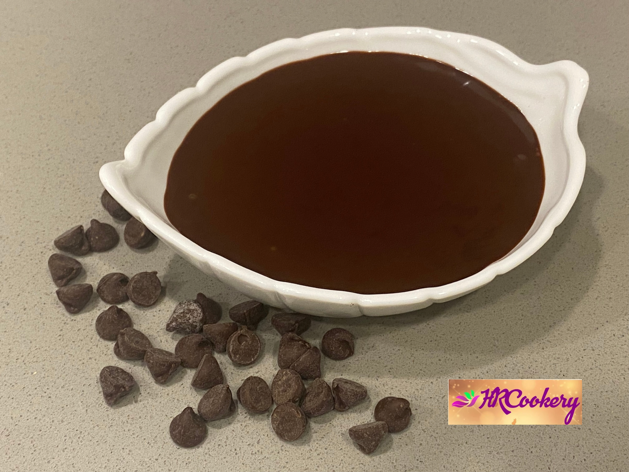 Glossy dark chocolate ganache drizzled over a rich mud cake, showcasing a decadent dessert.