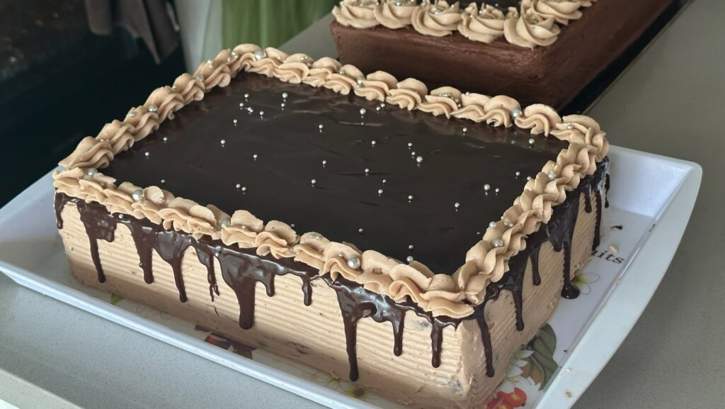 9×13-inch Ultimate Fudge Fantasy chocolate cake with chocolate ganache and piped buttercream border
