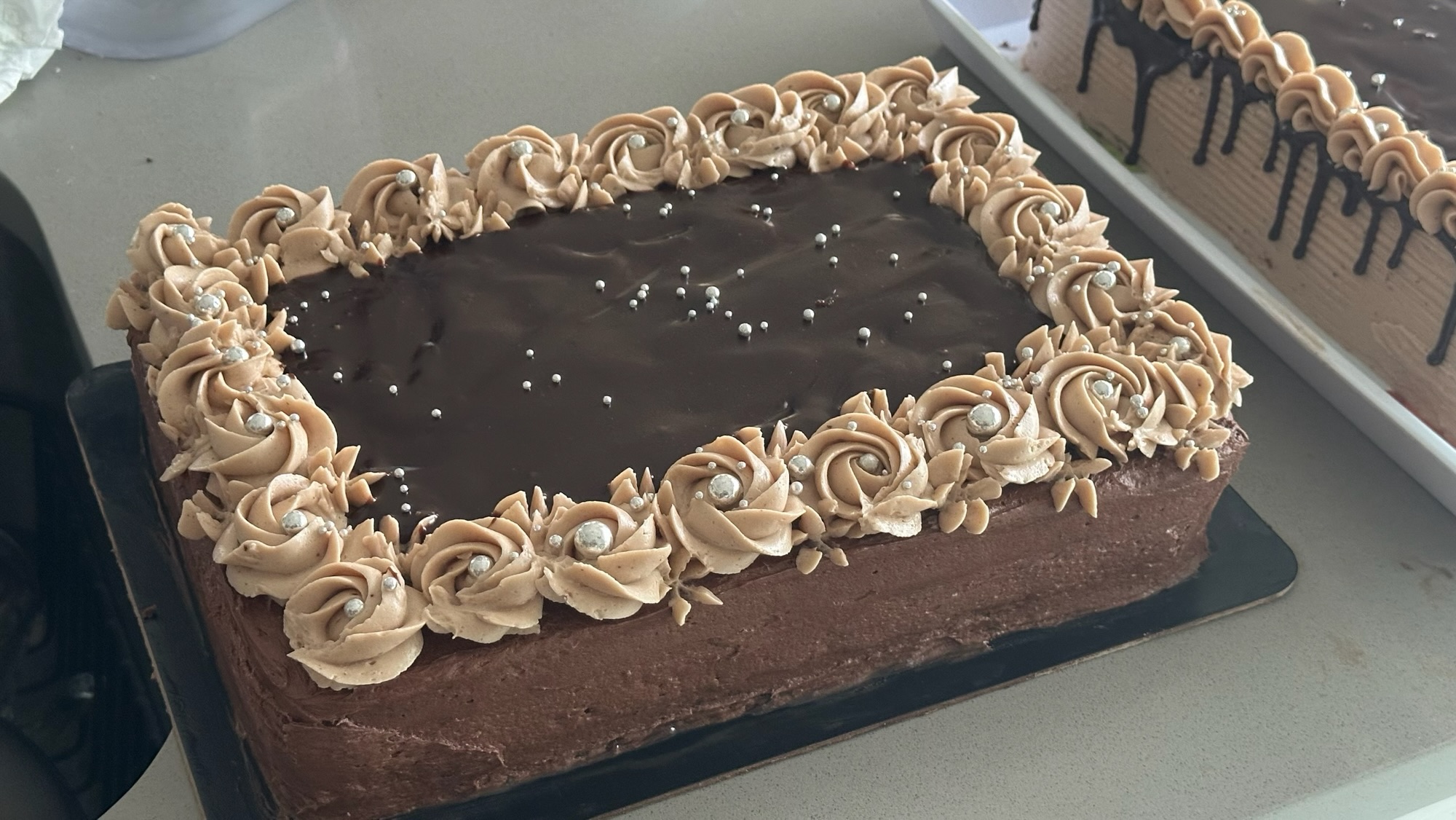 9×13-inch Ultimate Fudge Fantasy chocolate cake with chocolate ganache and piped buttercream border